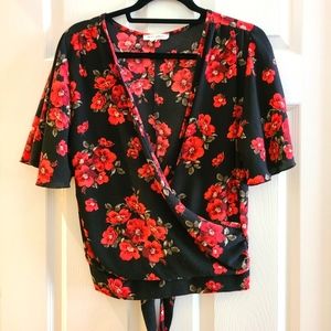 Juniors cross v neck top